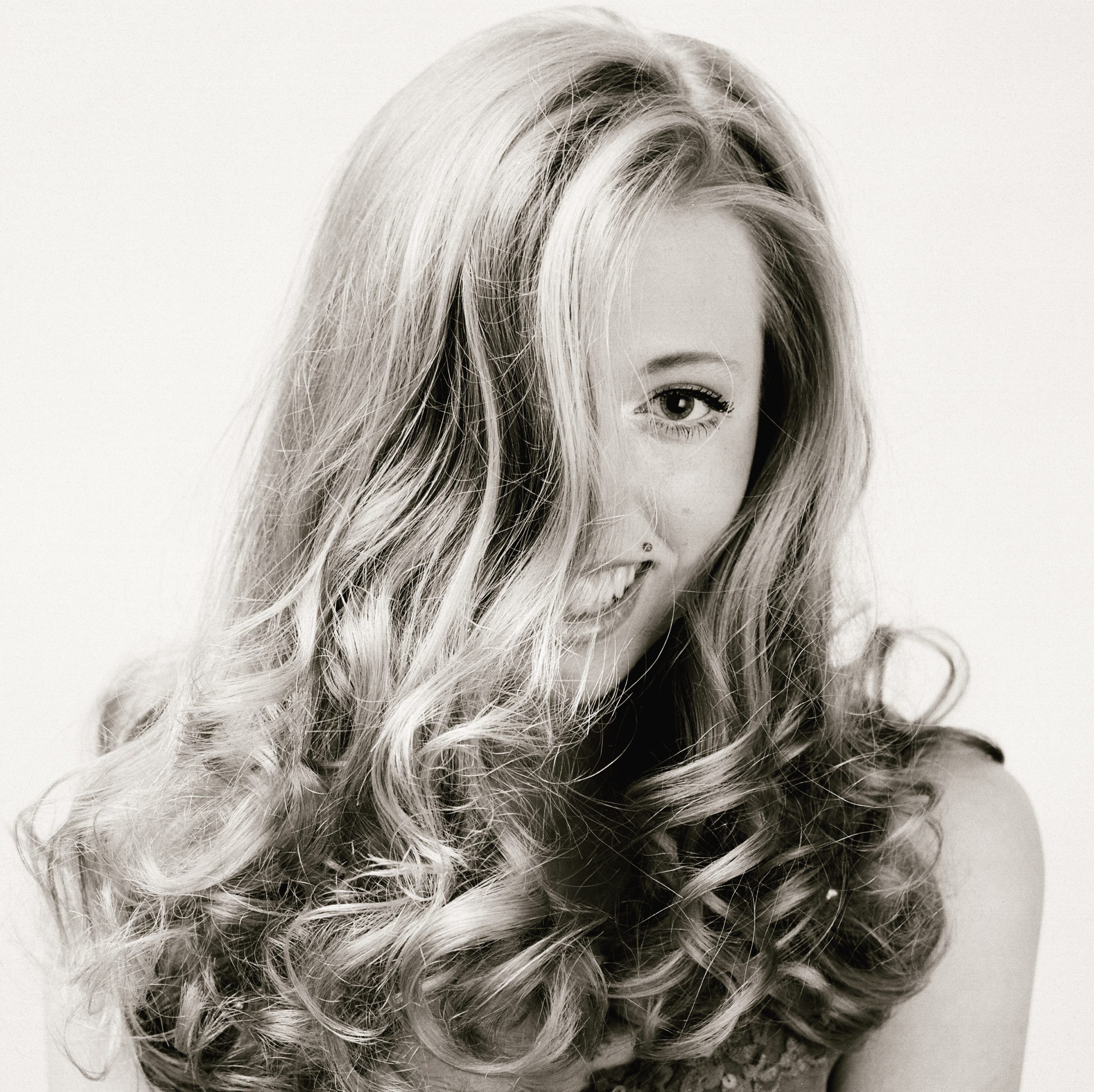 Picture of blonde woman with volume in hair