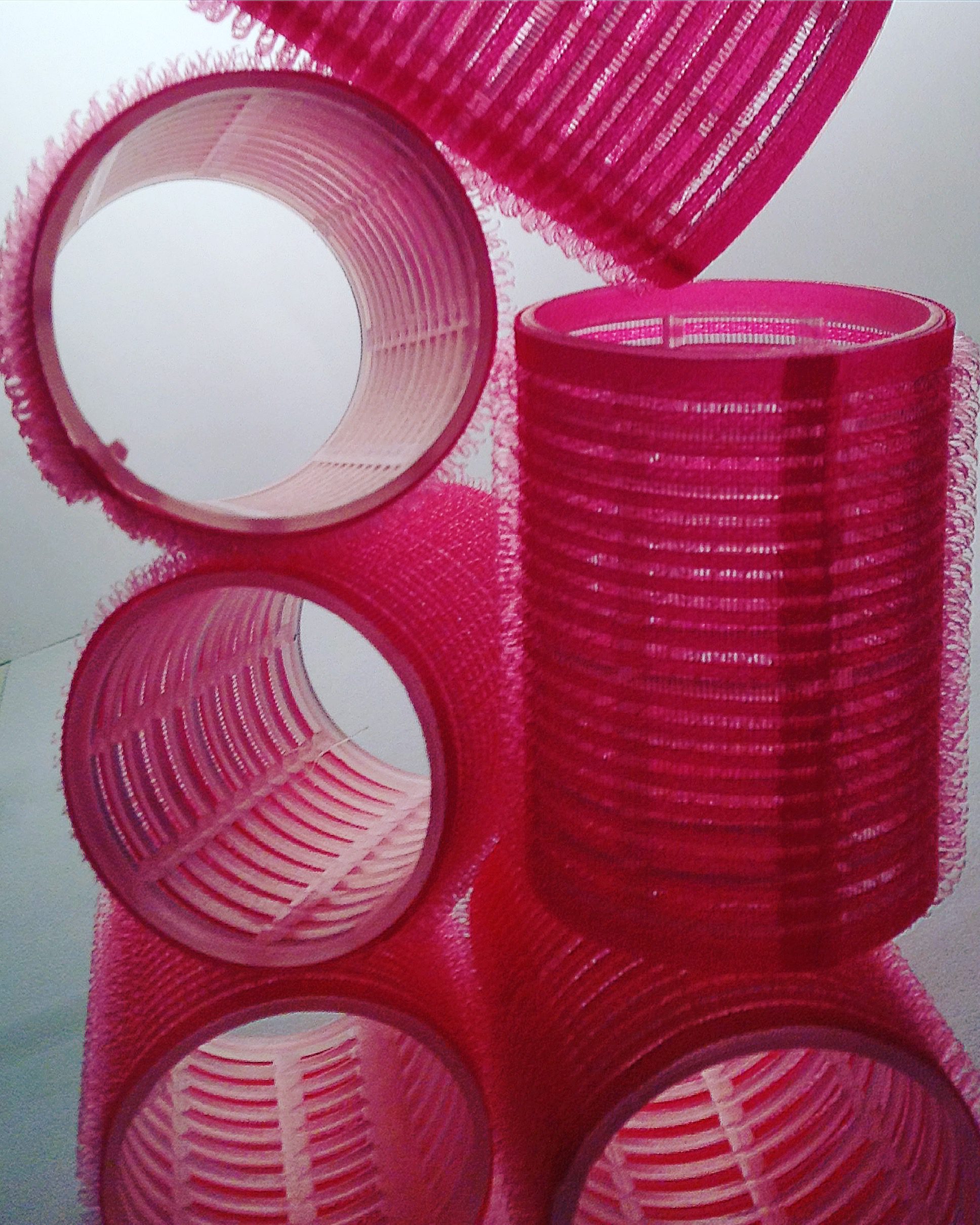 pink velcro rollers stacked
