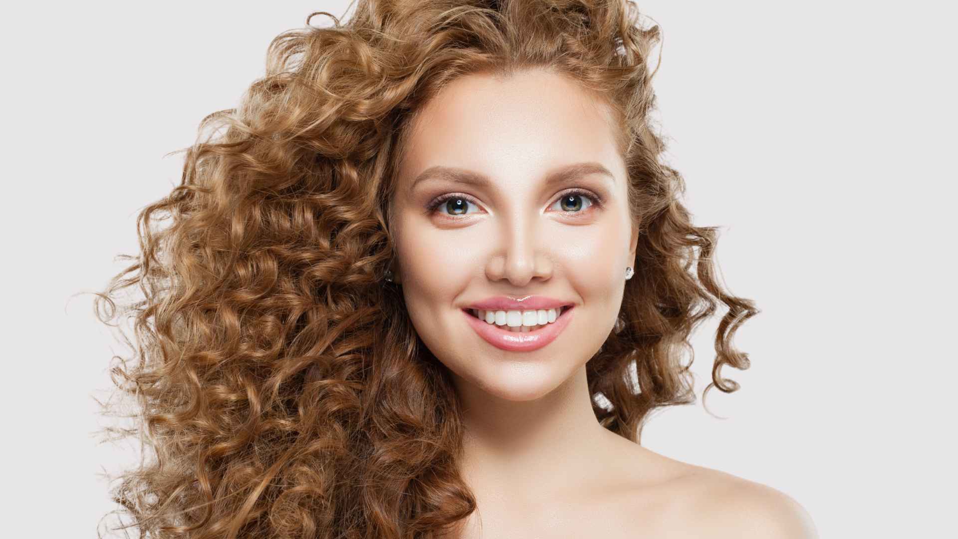 Female with long natural curly hair