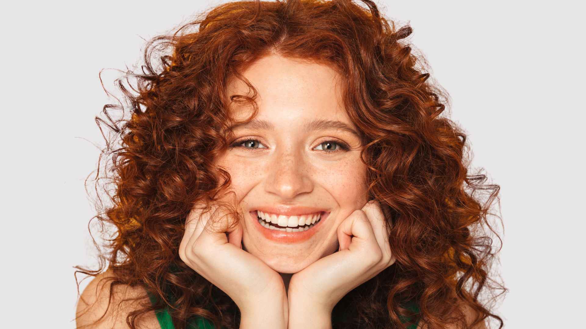 Smiling female with red curly hair