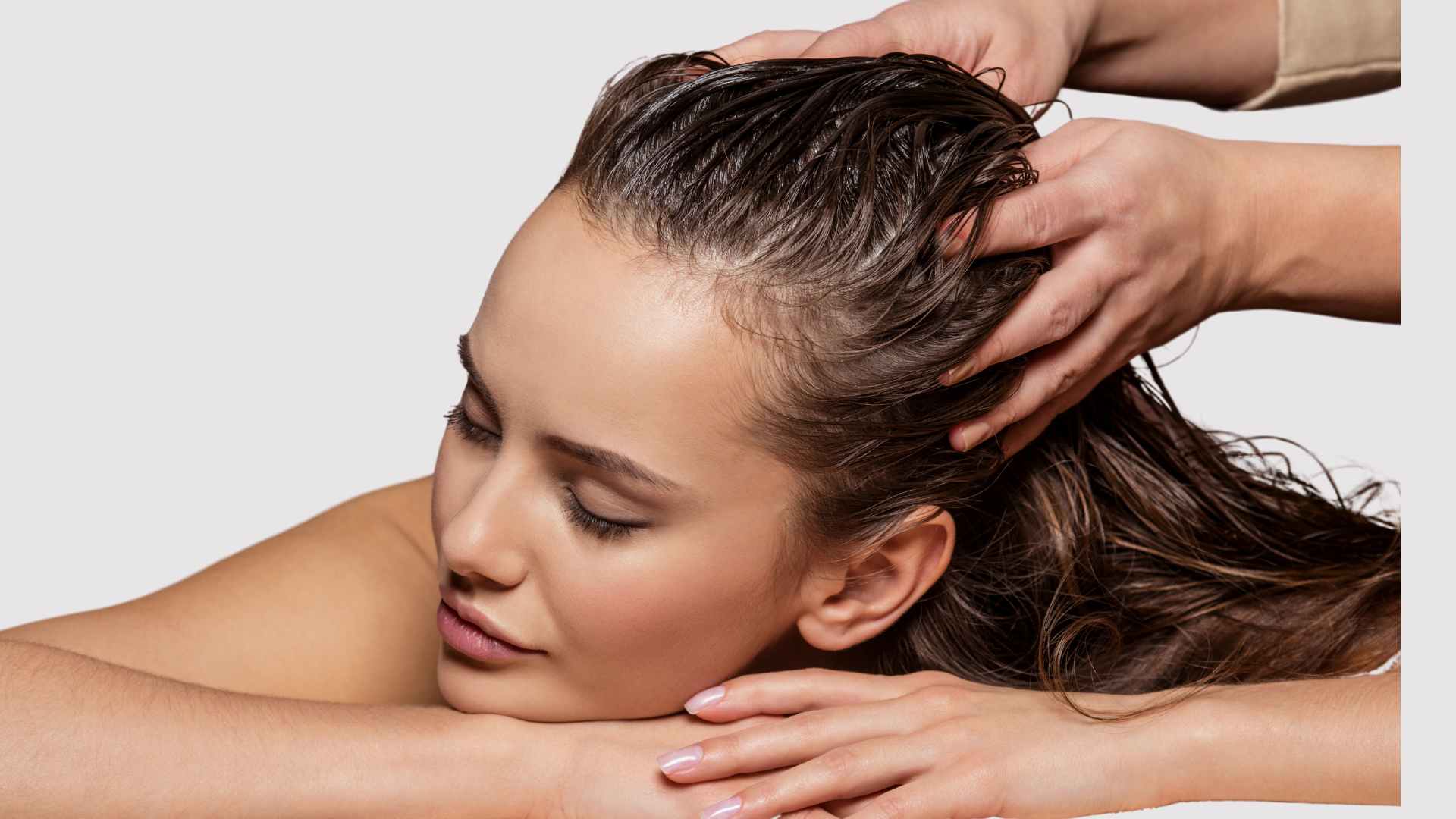 Female getting a scalp massage for scalp health to promote shiny hair