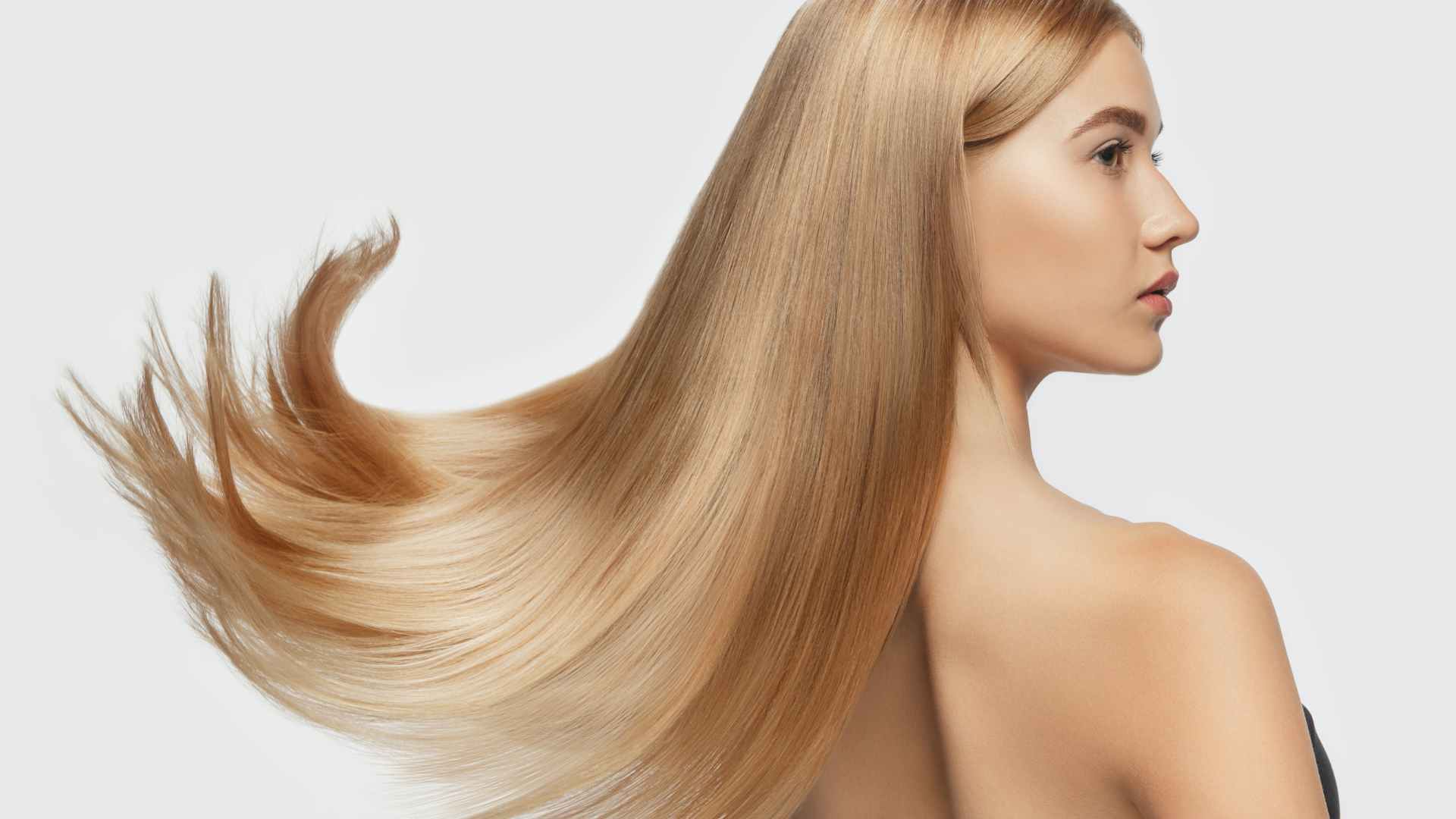 female with long blonde hair free from split ends