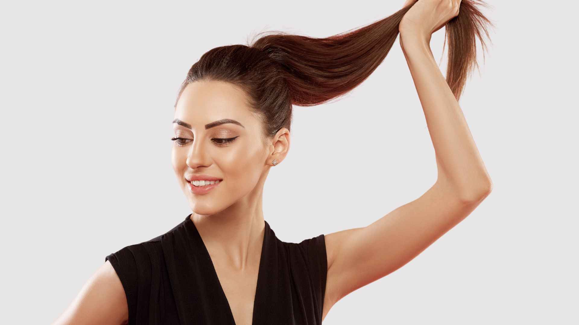 Damaged Hair: Female with hair in pony tail, damage at the ends of hair