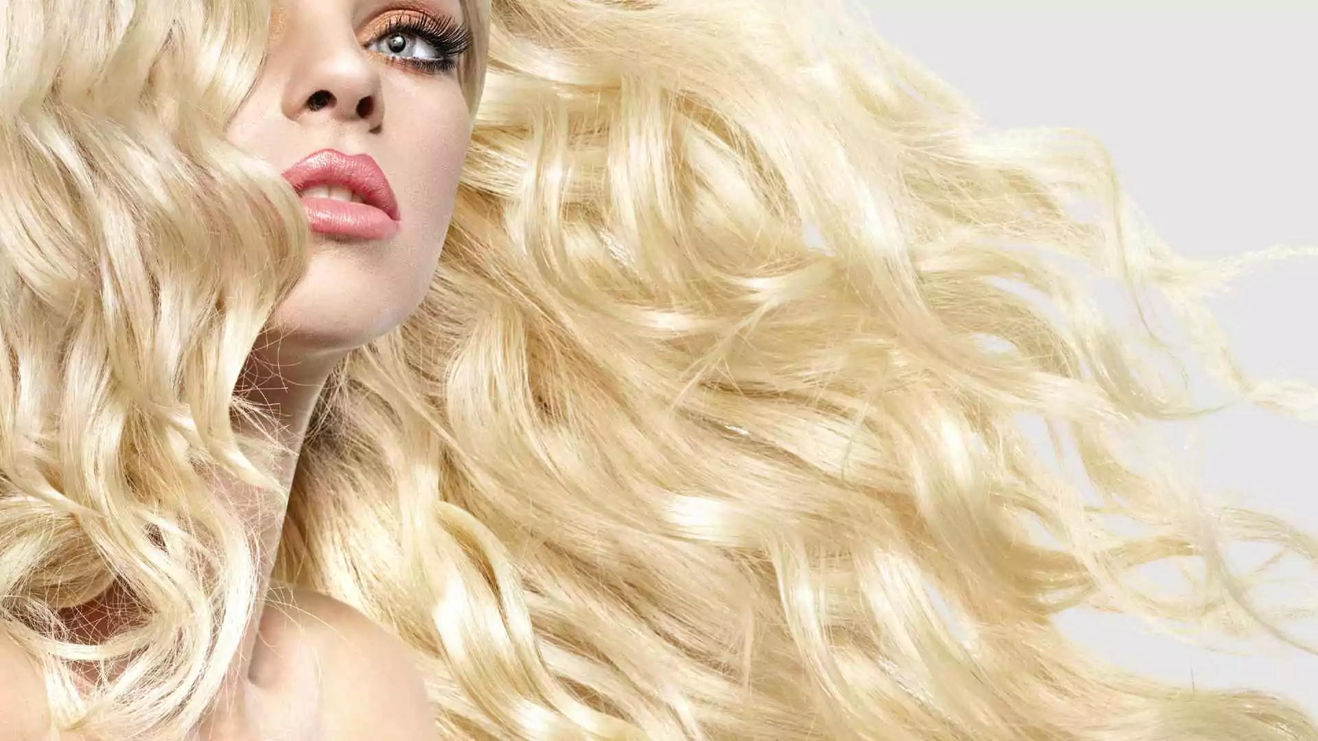Female model with long bleached hair that is shiny and silky