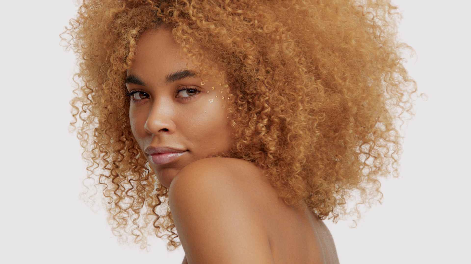 female model with healthy dyed afro hair