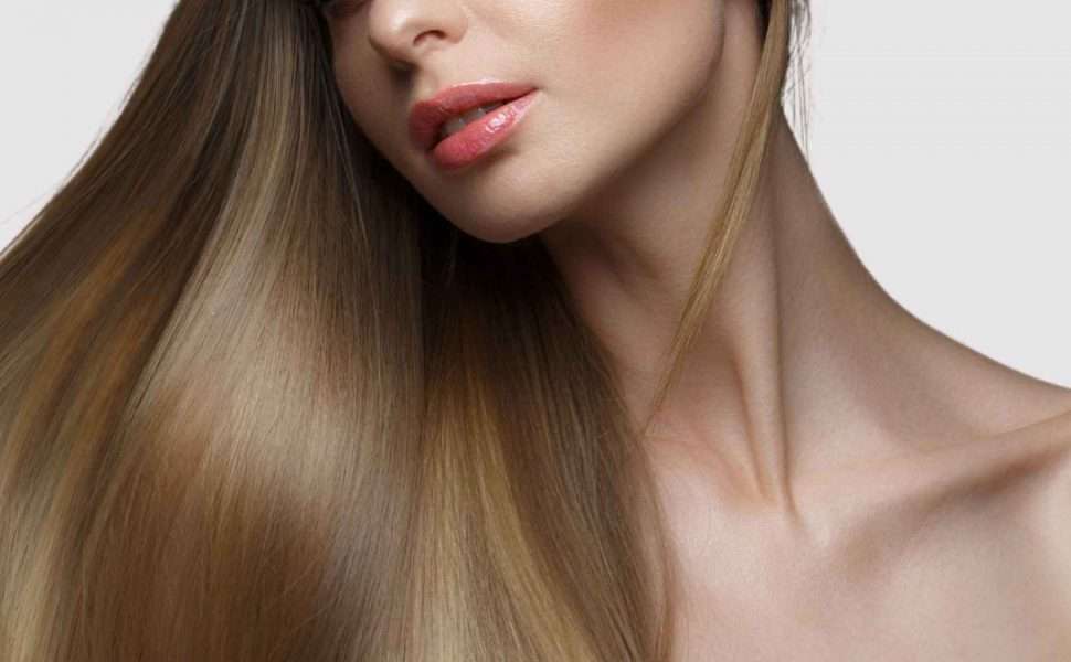 female with long shiny hair following treatment with deep hair conditioner