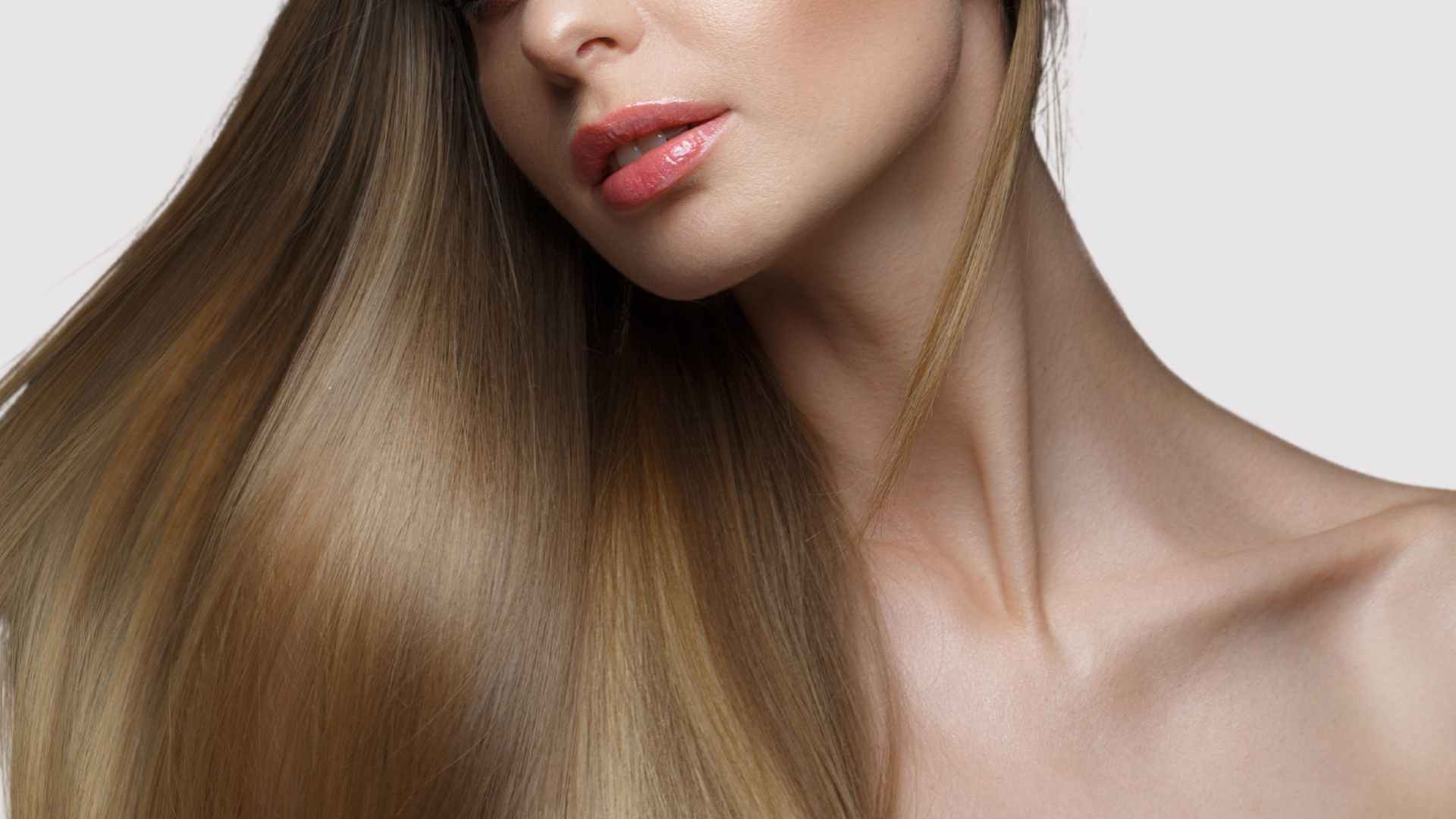 female with long shiny hair following treatment with deep hair conditioner