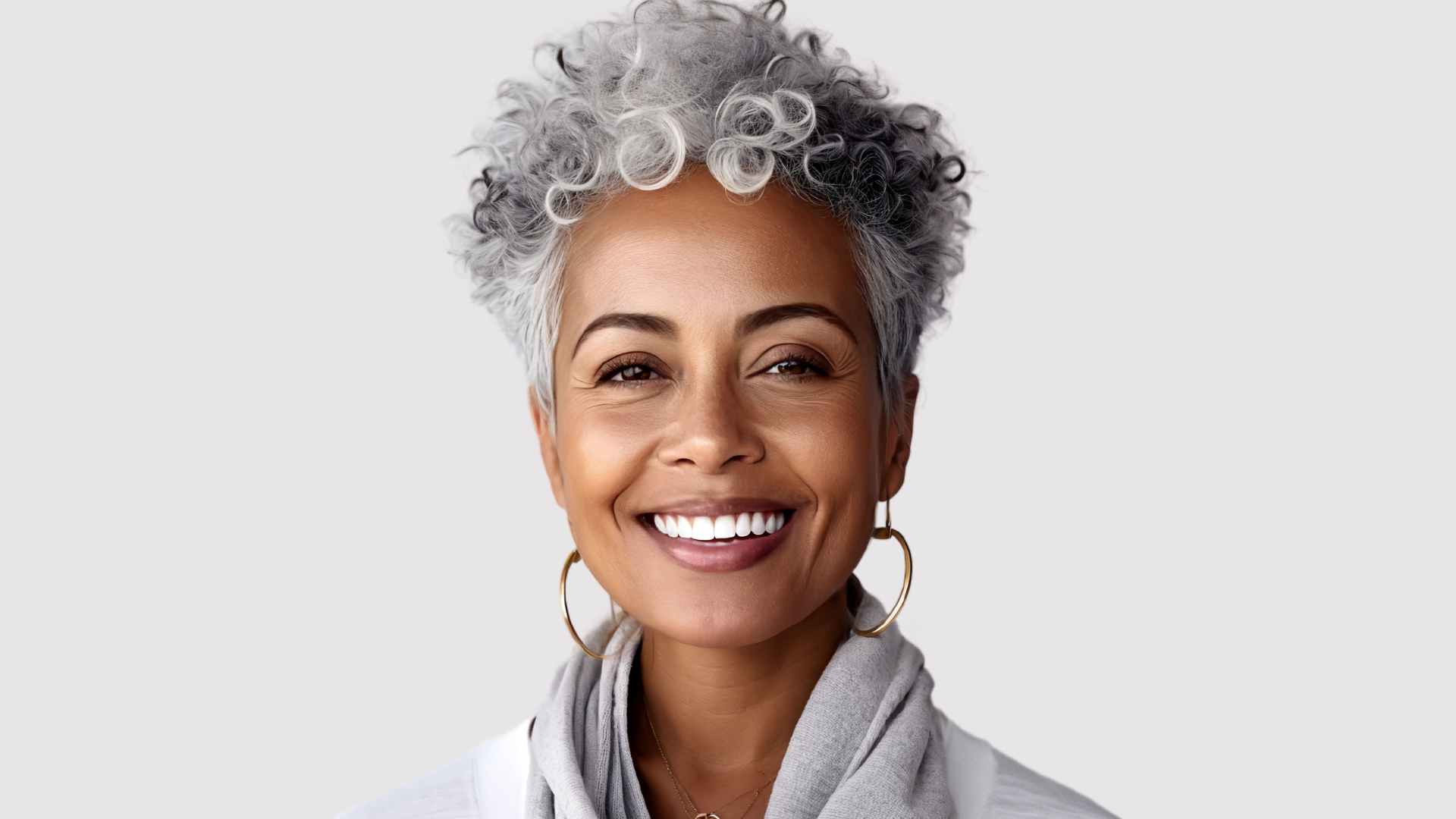 Short, curly grey hair with length on top