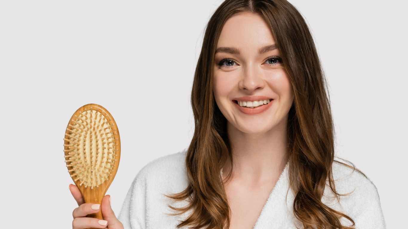 Summer Hair Care Tips | Smiling Female with Long Hair holding Brush
